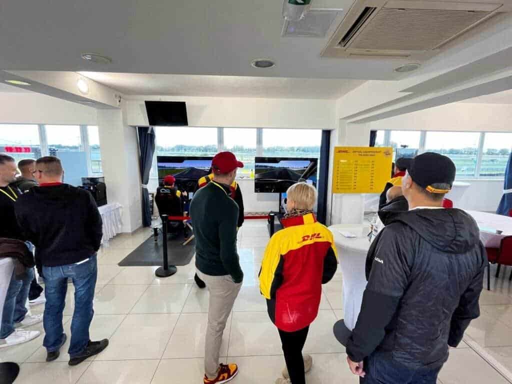 DHL Express competition for the best times on a real racing track with two motion simulators connected together in London, UK.