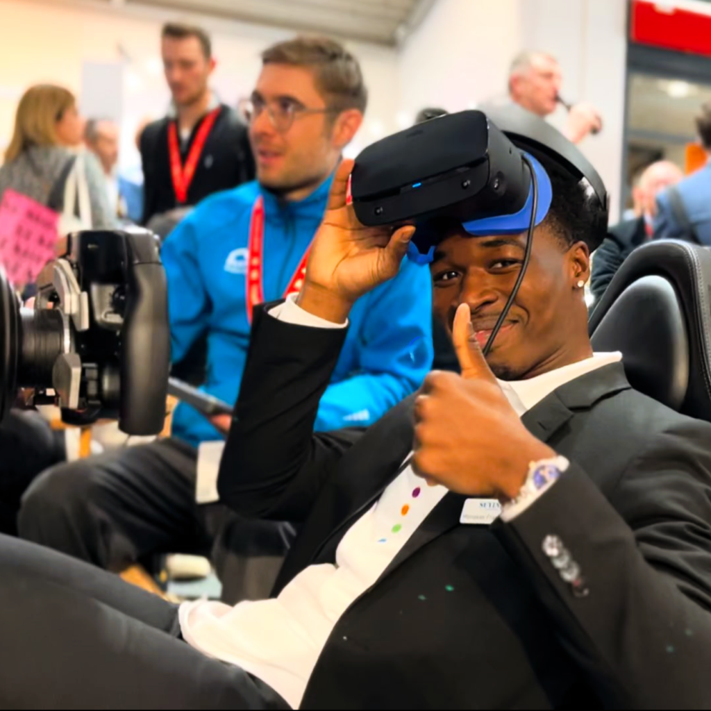 Happy person on VR Formula simulator hire in Munich.