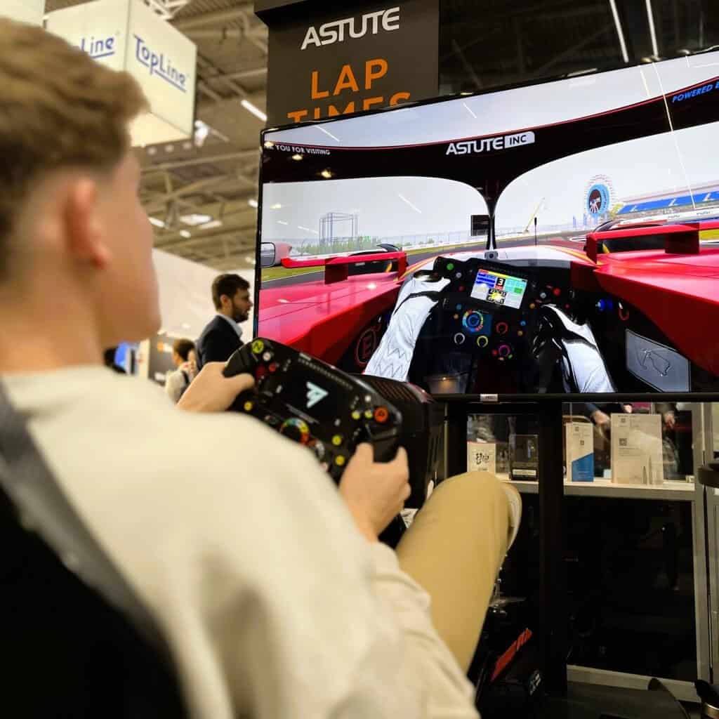 Person on motion racing simulator with virtual branding in Munich.